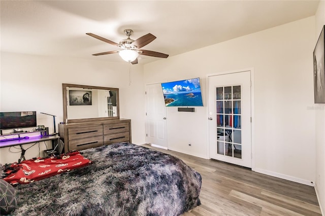 bedroom with ceiling fan and wood-type flooring