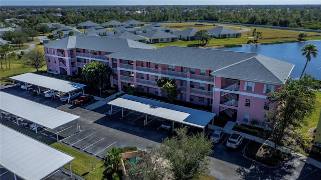 birds eye view of property with a water view