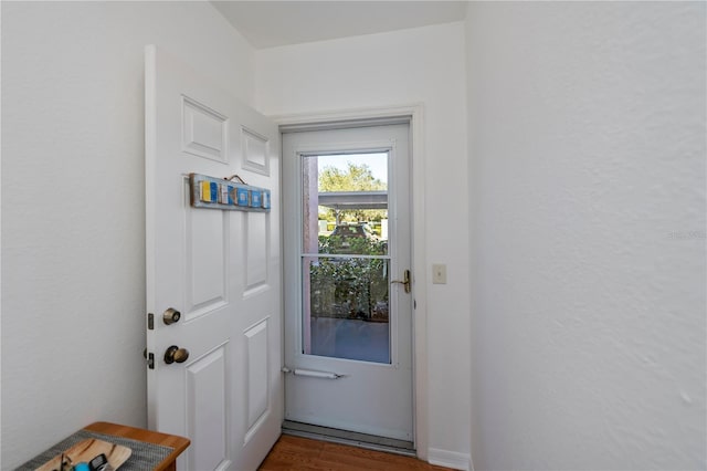 doorway to outside with dark hardwood / wood-style floors