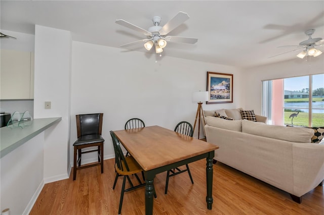 dining area featuring light hardwood / wood-style flooring and ceiling fan