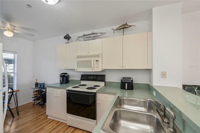 kitchen with ceiling fan, sink, white appliances, and light hardwood / wood-style flooring