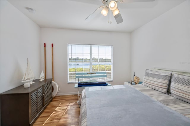 bedroom featuring ceiling fan and wood-type flooring