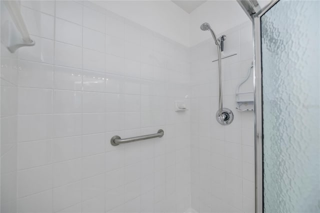 bathroom with a shower with shower door