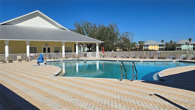 view of swimming pool with a patio