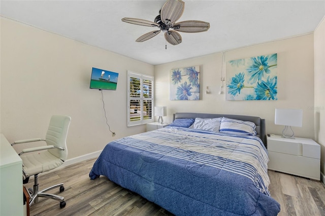 bedroom with ceiling fan and light hardwood / wood-style flooring