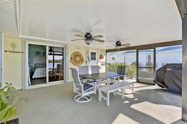 sunroom / solarium with ceiling fan