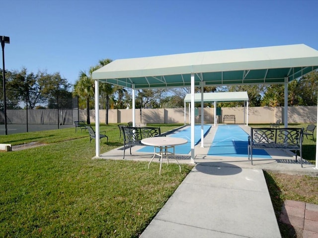 view of property's community with a gazebo and a lawn