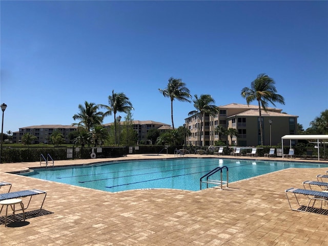 view of swimming pool featuring a patio area