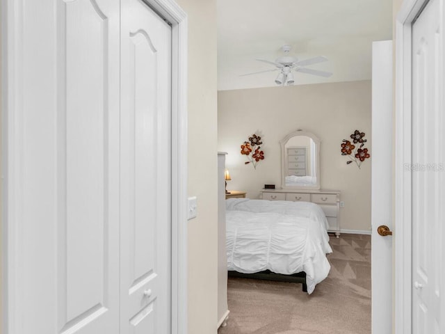 carpeted bedroom featuring ceiling fan