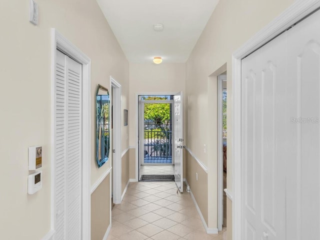 doorway to outside featuring light tile patterned floors