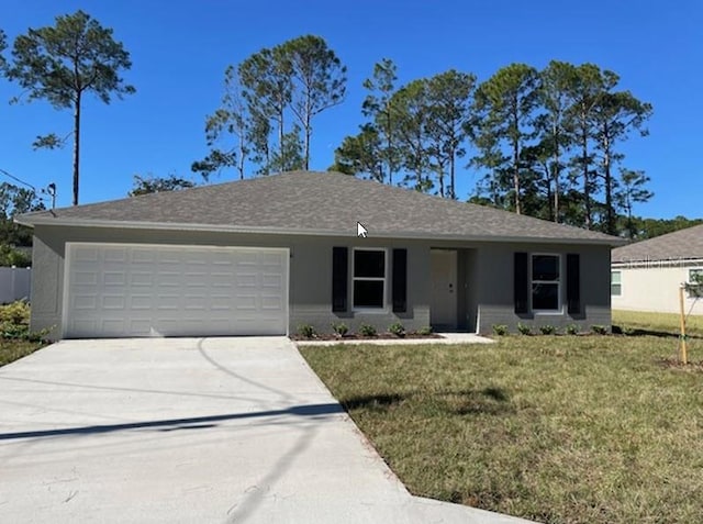 ranch-style home featuring a garage and a front yard