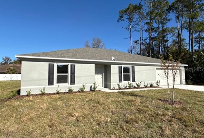 ranch-style house with a front yard and a garage