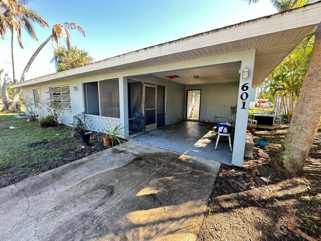 entrance to property with a carport