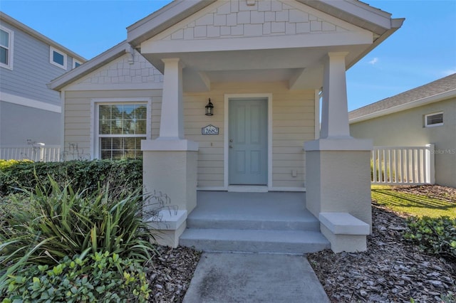 doorway to property with a porch