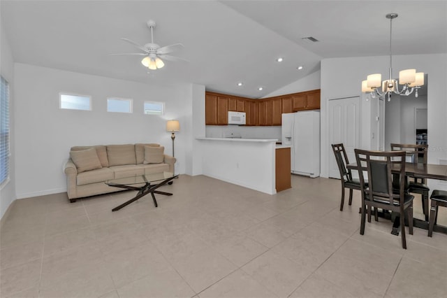 tiled living room with ceiling fan with notable chandelier and vaulted ceiling