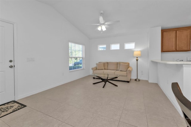 unfurnished living room featuring ceiling fan, lofted ceiling, and light tile patterned floors