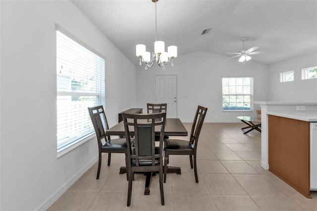 dining space featuring light tile patterned floors, ceiling fan with notable chandelier, and vaulted ceiling