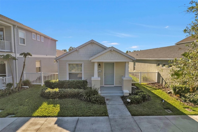 view of front of home featuring a front lawn and a porch