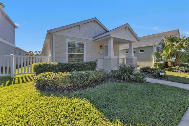 view of front of property with a front lawn