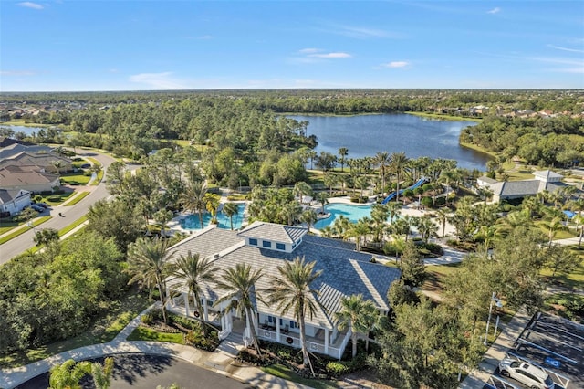 birds eye view of property with a water view