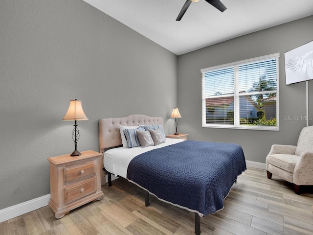 bedroom featuring ceiling fan and light hardwood / wood-style flooring