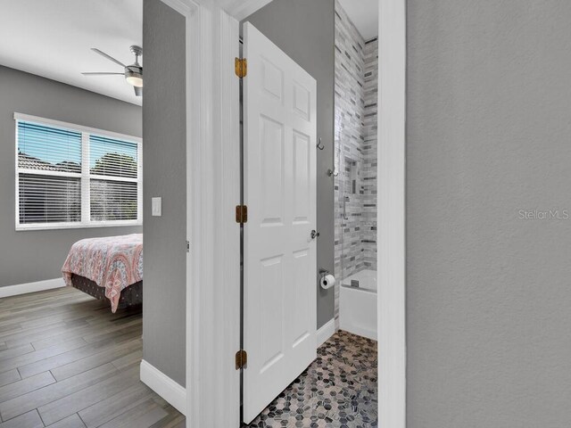 corridor with hardwood / wood-style floors