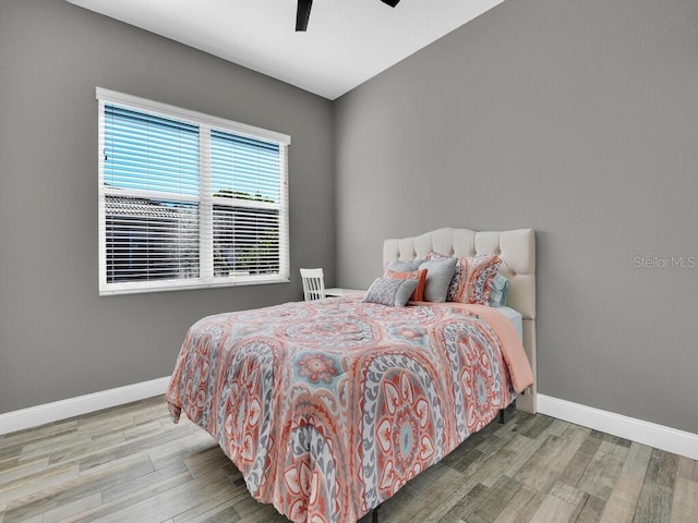 bedroom featuring hardwood / wood-style flooring and ceiling fan