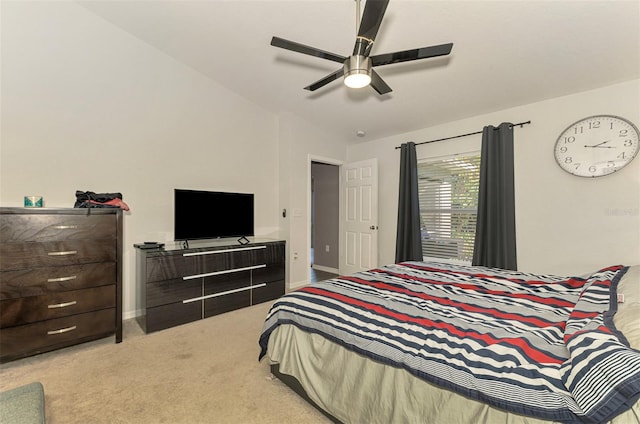 bedroom with ceiling fan and light carpet