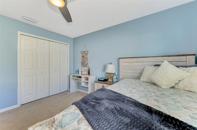 bedroom featuring light carpet, a closet, and ceiling fan