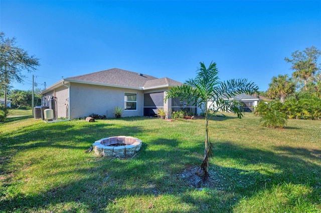 view of yard with an outdoor fire pit