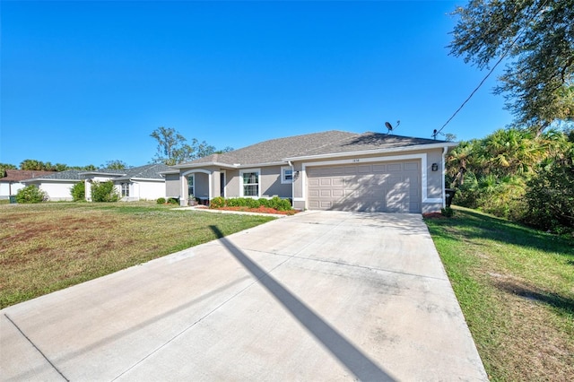 single story home with a garage and a front lawn