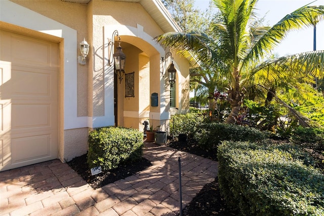 entrance to property featuring a garage