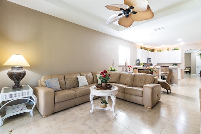 living room featuring ceiling fan and light tile patterned floors