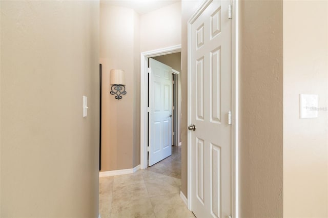 hallway featuring light tile patterned floors