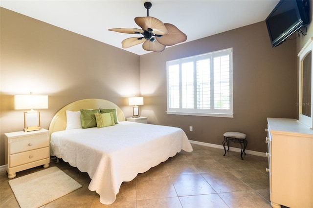 tiled bedroom with ceiling fan