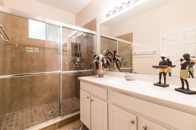 bathroom with vanity and an enclosed shower