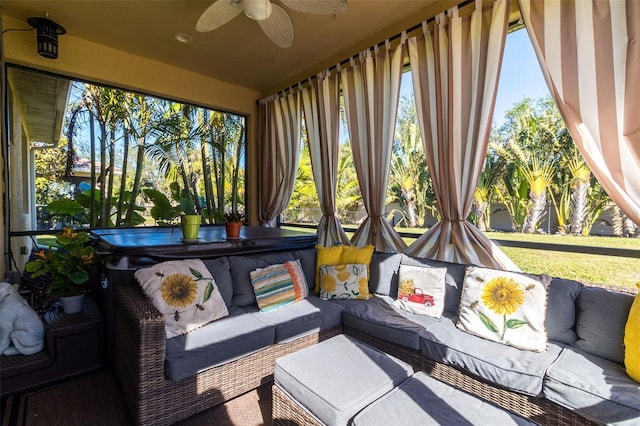 sunroom / solarium featuring ceiling fan