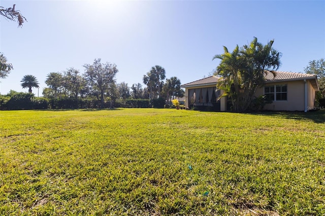 view of yard featuring a sunroom