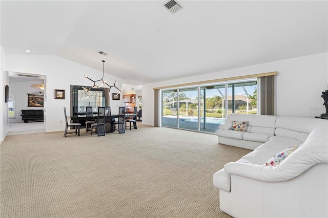 living room with light carpet and lofted ceiling