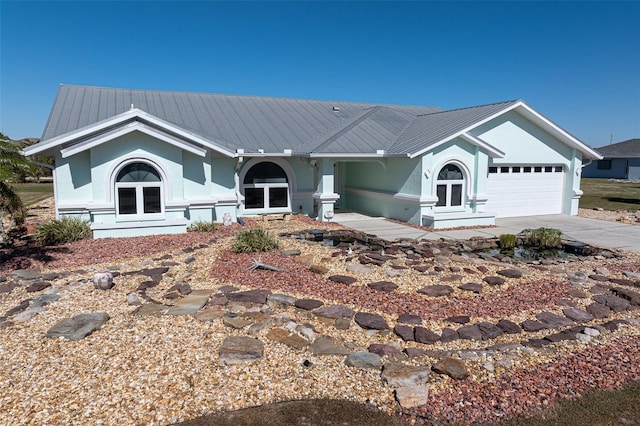 single story home featuring a garage