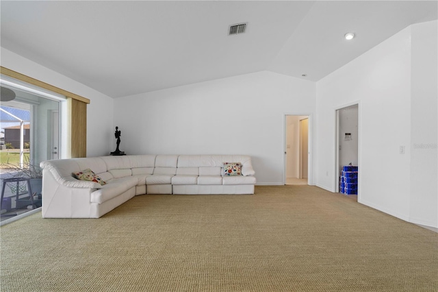 unfurnished living room featuring light colored carpet and lofted ceiling