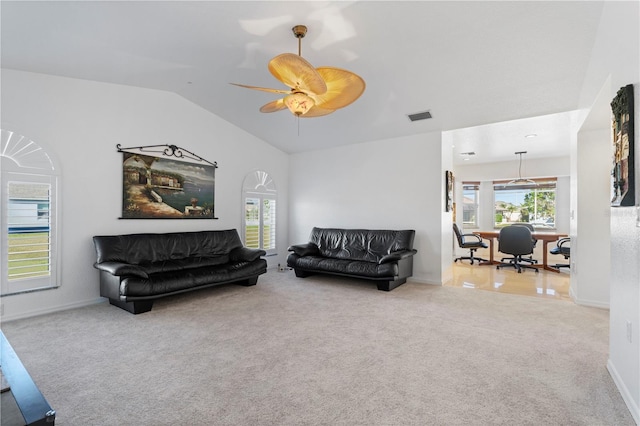 living room featuring ceiling fan, lofted ceiling, and light carpet