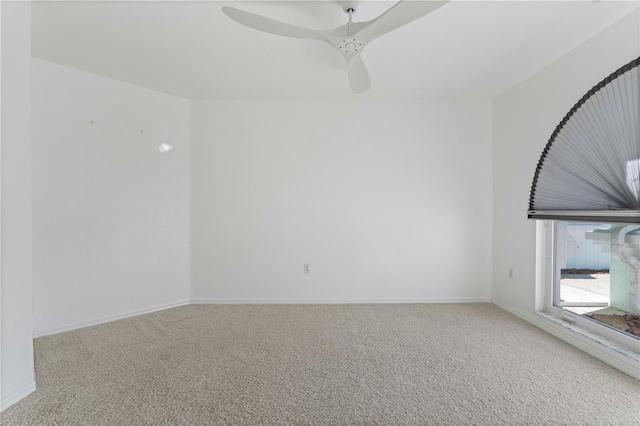 unfurnished room featuring ceiling fan and carpet floors