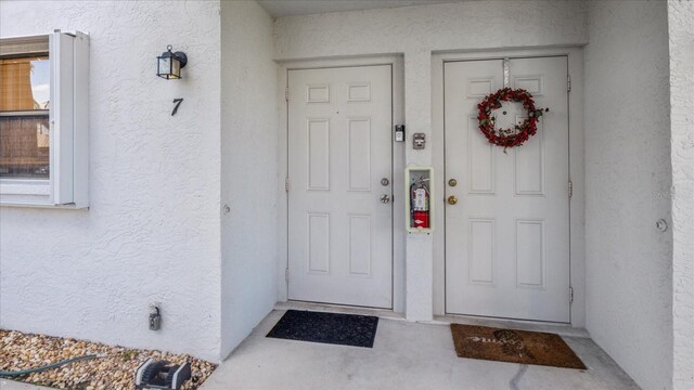 26485 Rampart Blvd Unit E7, Punta Gorda, FL 33983 - entrance to property with stucco siding