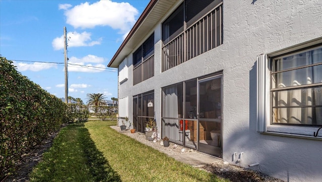 view of side of home featuring a yard