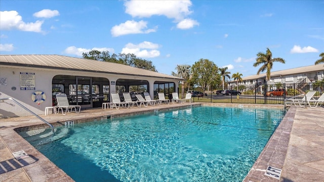 view of swimming pool featuring a patio area