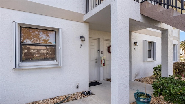 26485 Rampart Blvd Unit E7, Punta Gorda, FL 33983 - view of exterior entry with stucco siding