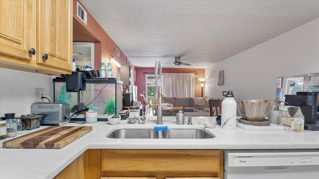 26485 Rampart Blvd Unit E7, Punta Gorda, FL 33983 - kitchen featuring dishwasher, ceiling fan, light countertops, a sink, and open floor plan