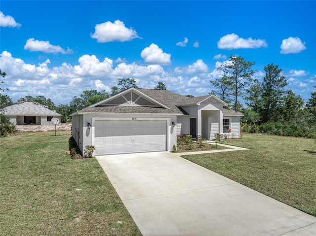 view of front of house with a front yard and a garage