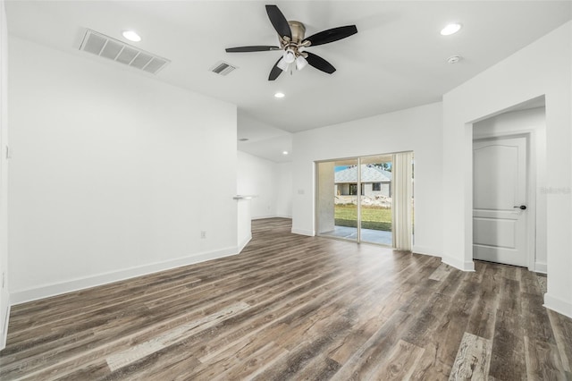 unfurnished living room featuring dark hardwood / wood-style flooring and ceiling fan